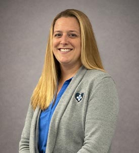 Brianna posing for a picture on grey background