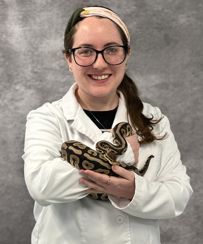 Dr. Michelle Kelley smiling and holding snake